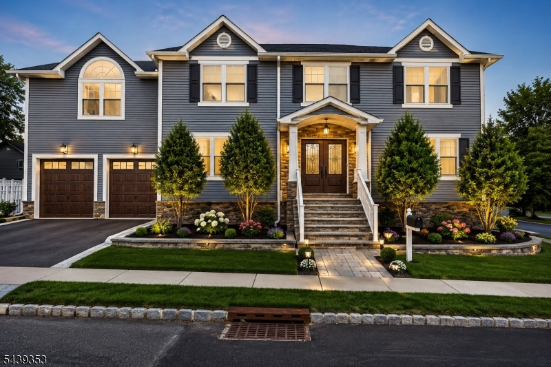 Welcome to this impressive custom Colonial offering over 3,500 sq ft of beautifully designed living space, ideally situated on a desirable corner lot in the heart of town. The open concept floor plan features a spacious Living Room with fireplace that flows seamlessly into the Formal Dining Room and modern Eat-in Kitchen, complete with quartz countertops, a large center island, and ample cabinetry, making it perfect for everyday living and entertaining. A convenient Powder Room completes the first level. Upstairs, the spacious Primary Suite offers a walk-in closet, private balcony overlooking the backyard, and an en-suite Bath with jetted tub, while four additional Bedrooms, a full Bathroom, and second-floor Laundry Room provide plenty of space and convenience. The fully finished Basement offers endless possibilities with a large Family Room and flexible space for a Recreation Room, Playroom, Home Office, or Gym. Additional highlights include multi-zone heating, central air, an attached two-car Garage, oversized driveway, and a private fenced backyard featuring a relaxing picuzzi and plenty of room for outdoor entertaining. Conveniently located close to parks, schools, shopping, dining, major highways, and NYC transportation, this exceptional home combines space, comfort, and convenience in a prime location.