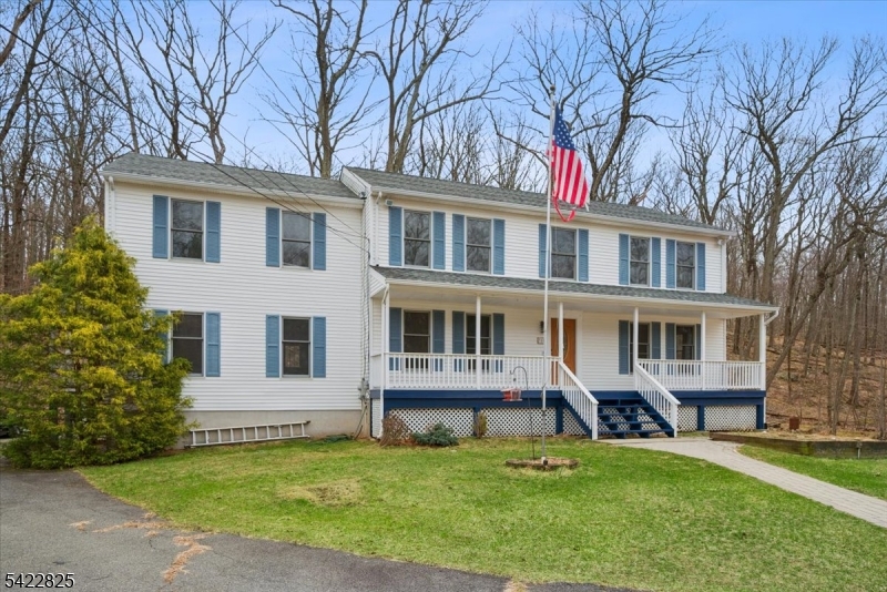 Spacious 5-bedroom, 2.5-bath Colonial set on over 1 acre of private property in desirable Hopatcong!This well-sized home offers approximately 3,200 sqft of living space,providing plenty of room for comfortable living and entertaining.Features include a versatile layout with multiple living areas, generously sized bedrooms, and a true mother-daughter setup with a separate entrance ideal for extended living or added flexibility.Beautifully updated and truly move-in ready, this home offers the perfect blend of comfort and style.Featuring brand new appliances,new hardwood flooring throughout the main level,and brand new carpeting upstairs,every detail has been thoughtfully refreshed.All bathrooms have been completely renovated with modern finishes.The open-concept kitchen flows seamlessly into the living room, creating an ideal space for everyday living and entertaining. From the living area, step out onto a spacious porch complete with a jacuzzi perfect for relaxing or hosting guests.Enjoy a private, wooded backyard along with a front yard set far back from the street, offering peace, quiet, and added privacy. The home also includes a full unfinished basement, providing endless potential for storage or future finishing.An added bonus is the opportunity to join the beautiful Crescent Cove Beach Club, where you can enjoy lake access, dock your boat, and take full advantage of summer boating and waterfront living on Lake Hopatcong. A true turnkey opportunity you don't want to miss!
