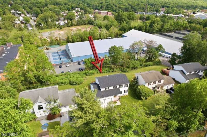 Welcome to an extraordinary opportunity in one of West Orange's most desirable and prestigious enclaves. Tucked away on a private road and surrounded by tranquility, this stunning 4-bedroom, 4 bath luxury residence has been meticulously renovated from top to bottom, offering the perfect blend of modern sophistication, comfort, and privacy. From the moment you enter, you'll be captivated by the impeccable craftsmanship, designer finishes, and thoughtfully curated upgrades throughout. The expansive floor plan is ideal for both everyday living and entertaining, featuring beautifully appointed living spaces and four generously sized bedrooms. The home's 4 spa-inspired bathrooms showcase state-of-the-art finishes, premium fixtures, and timeless design. A fully finished basement provides exceptional additional living space, perfect for a home theater, fitness area, recreation room, or guest accommodations. Adding to the property's unique appeal is direct access to an indoor tennis facility located immediately behind the home, an incredible amenity rarely found in residential living. Ideally situated just moments from Turtle Back Zoo, South Mountain Reservation, premier dining, shopping, and major commuting routes, this exceptional property offers the perfect combination of luxury, convenience, and lifestyle. Properties of this caliber, location, and level of renovation rarely become available. Experience the lifestyle you've been waiting for!