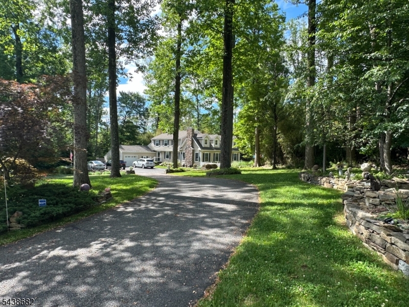 Desired Neighborhood of Dogwood Acres in Chester Twp....Cathedral Ceiling Great Room Addition in 2015 with Floor to Roof Stone Wall and Wood Burning Stove...Kitchen and Bath also Remolded in 2015...Private 1.4 acres with Large Trees...