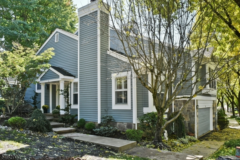 Welcome to 12 Knollcrest. This beautifully updated 3 BR, 2 1/2 bathroom end unit townhouse is situated  in the desirable Knollcrest section of The Hills. Plenty of light fills the home. HW floors throughout, newer kitchen with SS appliances, new range, refrigerator, and microwave purchased in 2021. Granite counter with a breakfast bar! Living room features a wood burning fireplace and sliding glass doors that lead to a large, private deck. Neutral paint throughout. First floor has family room with wood burning fireplace.  Expansive Master suite includes large walk in closet, remote control window treatments and a renovated bath. Laundry and powder room complete the second level. Third floor has an additional 2 bedrooms with their own bathroom. 3rd bedroom had a built in Murphy bed. Finished basement with den and a murphy door that leads to a meditation room.  New hot water heater installed in 2021. Whole house water filter and air purifier with Hepa filters, UV, and charcoal installed in 2021.  Garage has custom cabinets with plenty of storage and fiberglass flooring. Close to 78, 287 and train.  Low Taxes!! Great Schools! Community pool and tennis.