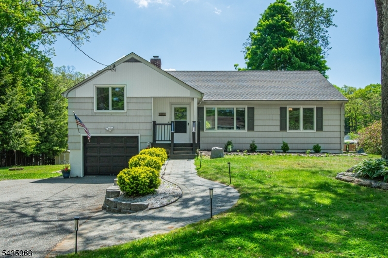Beautiful home located in the heart of the Lake Telemark neighborhood of Rockaway Township. Located on nearly half an acre this wonderfully maintained home offers the ease of open concept living plus a fully finished basement. Step inside to discover a bright and inviting layout featuring a spacious living room & sunny eat-in kitchen/dining combo with abundant natural light. Two generously sized bedrooms & a beautifully maintained full bath with tub/shower combination complete the main floor. A few steps away is the 3rd bedroom or family room. The finished lower level dramatically expands the home's functionality with a large den, flex room, laundry room and extensive storage options. Outside, enjoy the expansive yard with plenty of room for gardening, entertaining, or simply relaxing in your private outdoor retreat. Ideal for first-time buyers, downsizers, or anyone seeking comfort & versatility, this home has been exceptionally updated adding modern appeal while maintaining warmth & charm throughout. A wonderful opportunity to own a move-in-ready home with space, flexibility, & appeal both inside and out!