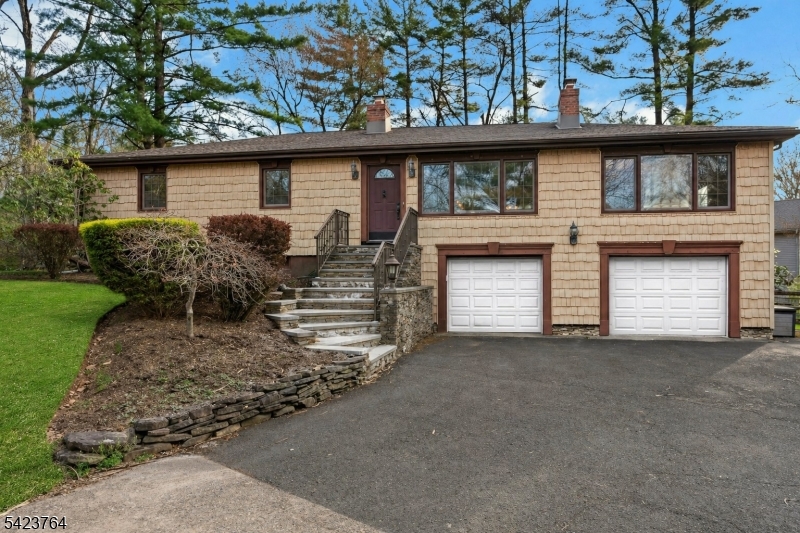 Welcome to 43 King George Road, a 2-acre flat property located in beautiful Warren where serene living meets endless possibilities! This charming raised ranch features three well-sized bedrooms, wood floors, and a gorgeously renovated full bath with custom marble tile work, a beautiful inlay design, and sleek glass doors. The thoughtfully updated custom kitchen is designed to impress! With custom ceiling height cabinetry, an industrial-sized KitchenAid refrigerator, a striking stone sink, and a breakfast bar, it's a dream kitchen for entertainers. The open layout creates an inviting flow, perfect for everyday living. The two oversized garages will be perfect for all your storage needs. The basement is a canvas waiting for ideas. With a full bath and tons of open space, the possibilities are endless. Set on a stunning, tranquil property, the outdoor space offers the perfect setting for your vision whether you dream of a lush garden retreat, play area, or simply enjoying peaceful surroundings. A whole-house generator adds year-round peace of mind. Just minutes from downtown Warren, the center of Martinsville, Route 22 & Highway 78. Don't miss the opportunity to make this property your own!
