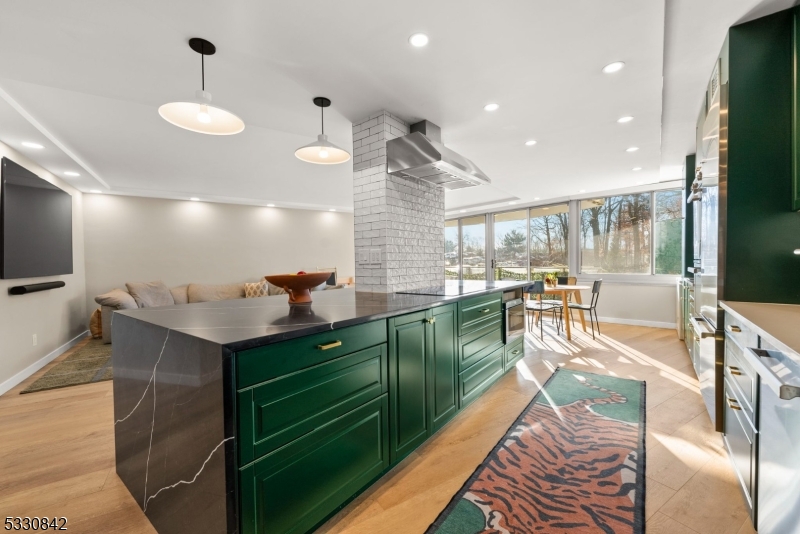 Just in time for Summer by the pool!!! This expansive unit at Claridge House 1, has been thoughtfully redesigned with an open concept kitchen, private primary suite, in-unit laundry room, and tons of storage. Natural light pours into the unit all day with its southeastern exposure, and full walls of windows in each room. The kitchen features Bertazzoni Appliances, a coffee bar flanked by pantry space, and a 6 seater breakfast bar. Your living room accommodates the largest TV off the shelf, and that huge sectional thats coming with you. The primary wing with a custom walk-in closet, spa-like bathroom and well designed bedroom is the epitome of residential indulgence. Add in beautiful wide plank floors, recessed lighting throughout, automatic window shades, an easy access powder room, large closets, 14' balcony and more! Claridge 1 is glowing with its recent common area revamp of the lobby and hallways. Amenities include 24 hr doorman/concierge/valet, Tennis and Pickleball courts, fitness room, heated outdoor pool with patio and grills and community room. HOA fee covers ALL utility costs and more! Come see this stellar condominium with full service amenities and unmatched convenience.