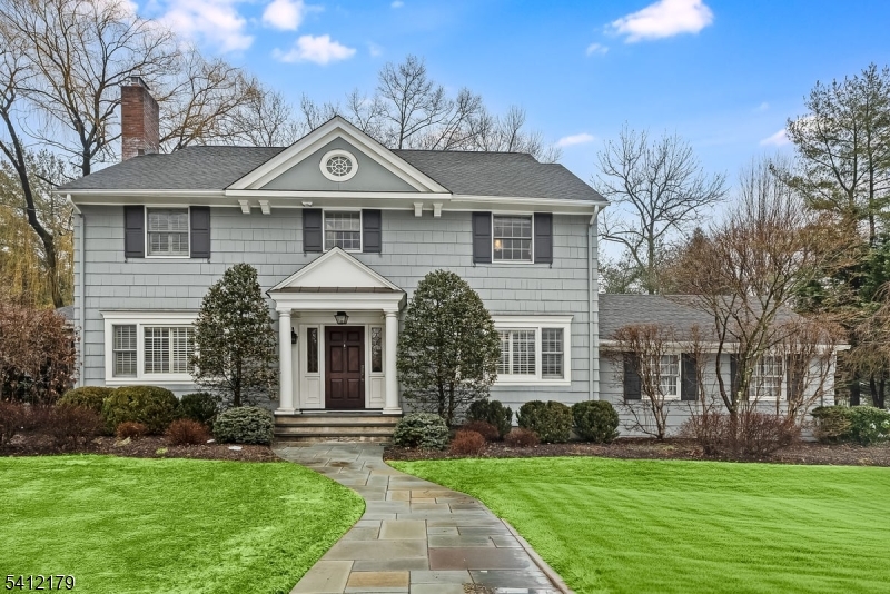 Move-in ready Center Hall Colonial in the coveted Woodfield Estates section of Short Hills.Extensively renovated in 2010 by premier architect John James, this exceptional 6-bedroom, 3.5 bath home offers 4 levels of refined living on a private, level .41-acre property w/ beautifully manicured grounds.The renovated 1st floor showcases craftsmanship w/ custom millwork & built-ins throughout.A welcoming foyer leads to a gracious living room w/ wood-burning fireplace, elegant dining room w/ wainscoting & a spacious family room w/coffered ceilings & gas fireplace. A private office w/ custom cabinetry, powder room, mudroom & first floor laundry add convenience.The gourmet eat-in kitchen features a large center island, dual sinks, custom cabinetry, pantry & premium appliances.The expanded primary suite offers 2 walk-in closets & a spa-like bath w/ radiant heated marble floors, jetted tub & glass-enclosed shower.3 bedrooms & an updated hall bath complete the 2nd level; 2 additional bedrooms & full bath are on the 3rd floor.Additional highlights include a finished lower level, generator, water softener, newer sump pumps, newer AC, Cat5 wiring, surround sound w/ Sonos, security cameras, alarm system w/ alarmed jewelry drawer, partial new windows & updated plumbing & electrical in renovated areas.Exterior features a bluestone patio w/ gas line, sprinkler system & attached heated two-car garage w/ NEMA 14-50 outlet for electric vehicle.Prime location near parks & top-rated schools.