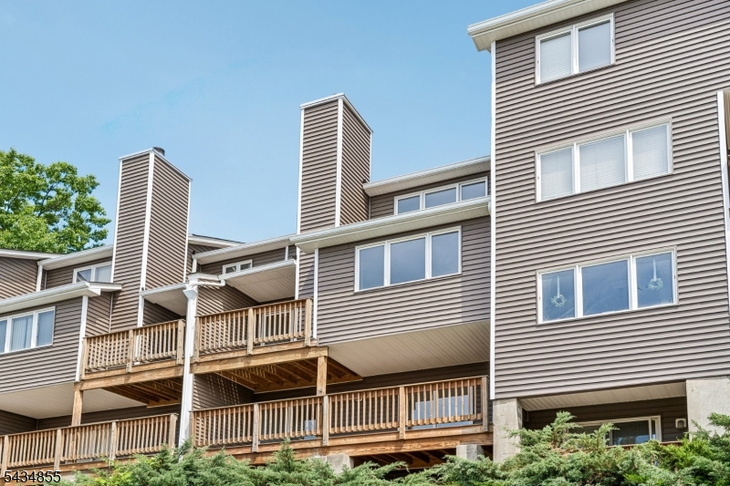 Immaculate and spacious 3 Bedroom, 2.1 Bath townhome located in the quiet and private Haledon Heights community offering stunning skyline views from your private deck! This multi-level home features a ground level with 2 Bedrooms, Full Bath, and Laundry area. The main living level offers a bright and airy Living room with Fireplace, Formal Dining room, Kitchen, and Powder room. The second floor features a spacious Master Bedroom with Master Bath and Loft area. Large finished basement includes a Family room, perfect for additional living and entertaining space. Home also features new siding, 1-car garage, and so much more. A true must see!