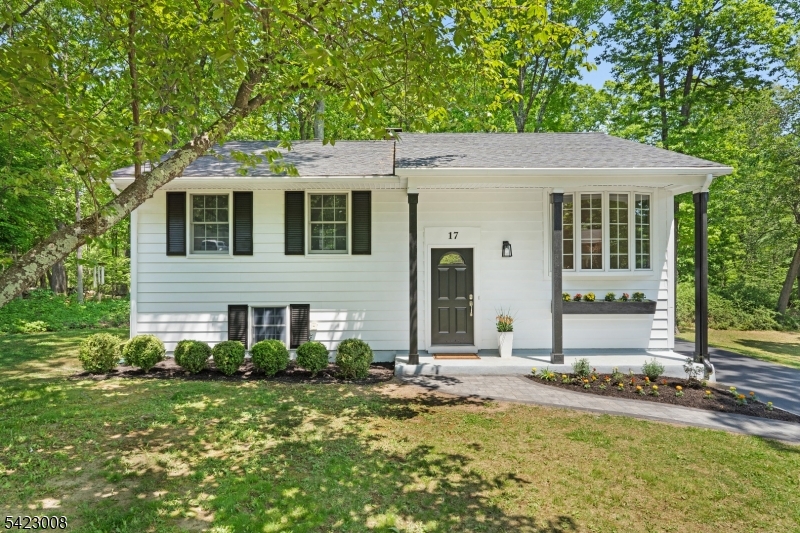 Welcome to this newly renovated bilevel, positioned perfectly on a gorgeous double lot, offering a park-like setting. This lovely 4 bedroom/2 bath home offers many recent updates, including all-new waterproof, pet-proof flooring and fresh paint throughout both floors.  Front entry foyer with a few steps to the spacious living room with a beautiful bay window.  Formal dining room opens to spacious & refreshed kitchen with all new, 2026 Whirlpool Stainless Steel appliances - perfect for entertaining.  Dining room opens to the upper deck  -  barbecue or just relax.  Three bedrooms with a stunning, updated bathroom complete this floor plan.  The lower level includes a 4th bedroom or office, a convenient full bath, and a spacious family room for additional living space.  A large utility & laundry room with enough table space to offer additional opportunities for a workshop or scrapbooking area. Walk out to the beautiful and level backyard and enjoy the outdoors.  The property borders a walking path to Fields & HS maintained by the town. So close to schools, recreation and sports fields, and more. City Sewer & Water.  Check off the boxes for a new Furnace & Roof. Convenient commuter location - routes 206, 183, 46 & 80 are minutes away. Location, location ... this is it! Purchase includes contiguous property -40 x 100 Block 10807, Lot 15.