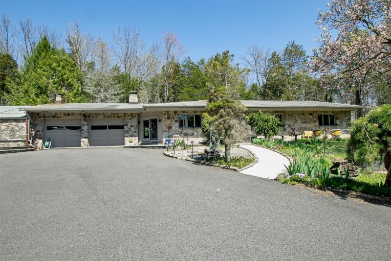 This totally unique property offers two separate homes. Perfect in-law suite, home office, additional income, the possibilities are endless! The main ranch style home boasts 3 bedrooms 3 & one-half baths, kitchen with breakfast bar and separate dining area, light and bright living room with wood burning fireplace. The indoor pool with sauna, bar area and window walls make for the ultimate entertainment space! The second home offers 2 bedrooms and 2 full baths with finished basement. The desirable commuter location close to major roadways, shopping & dining is surrounded by close to 5 acres of wooded privacy and park like property! This home is truly a must see!