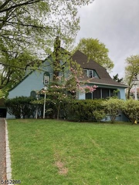 Home Sweet Home this charming and spacious 4br 2.5 bath Tudor. H/W throughout 1st and 2nd levels.   Inviting entryway into LR w/ FP, screened in porch to sip coffee and watch the birds.  DR w/ chair railing, large kitchen w/ ss gas stove and dishwasher which leads to the backyard. 2nd level has 3 good size BR's w/ cedar closets, full bath and linen closet.  3rd level has MB w/ full bath, w/i closet plus more closets for tons of storage.  Full basement w laundry room, toilet, utility room and leisure room.  Large flat backyard great for entertaining.  2 car detached garage.  Outside just painted plus DR, and basement.  Verona boasts amazing schools and well known Verona Park, beautiful town pool and proximity to NYC trans. With a bit of updating make this your next home!