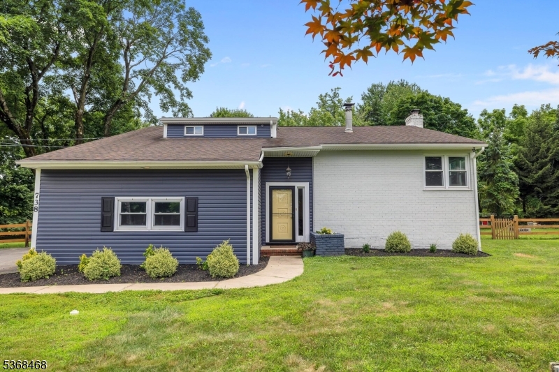 Welcome to this beautifully renovated 4-bedroom, 2.5-bath home, situated on just over an acre in one of Hillsborough's most desirable neighborhoods. Step inside to discover a bright, open layout filled with natural light and stylish updates throughout. The stunning kitchen is a true showstopper, featuring quartz countertops, a farmhouse sink, stainless steel appliances, and a large island perfect for cooking and entertaining. Enjoy cozy evenings in the inviting den, complete with a fireplace ideal for relaxing with a book or movie night. The finished basement offers versatile living space, perfect for a home theater, playroom, gym, or office. The newly renovated primary bath boasts modern fixtures and a spa-like design, adding a touch of luxury. Freshly painted with a contemporary palette, this move-in-ready home also features a brand-new Trex deck overlooking a private, flat, fenced-in yard ideal for gatherings, play, or unwinding outdoors. A whole-home generator powers the entire property, including central AC, providing year-round peace of mind. Located in a top-rated school district, this home truly has it all: style, comfort, and convenience. Nothing to do but move in and enjoy!