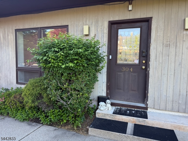 Large, (1,325 sq. ft.) updated two-level condominium at Wedgewood Plaza, offers 1 bedroom, 1.1 baths, central air, 15 x 8 private deck, in-unit full-sized front load washer and dryer, separate office/flex space, and parking adjacent to the amenities at Wedgewood Knolls. Enter directly into your unit from the sidewalk, just like a single-family home.  All hardwood floors on the main level, except for tiled floors in kitchen and baths. Newer luxury vinyl plank floors in bedroom and office. Updates and special features include: brand new furnace in 2026; newer hot water heater; newer roof and skylight (2021); 2-story kitchen with skylight, all stainless steel appliances, Bosch 5-burner gas range, pantry and storage area off kitchen; walk-in closet in bedroom. West-facing unit with gorgeous sunsets. Morning sun drenches the inside from the front. Commuting to NYC is a breeze with train and bus options located nearby, including 3 min. to Montclair State train station with 1250 car parking garage, 5 min. to Allwood bus Park & Ride with 30 min. to NY Port Authority, min. to Rts. 46, 3, 23, 80, GS Parkway. Just 10 min. to fine dining and boutique shops of downtown Montclair.