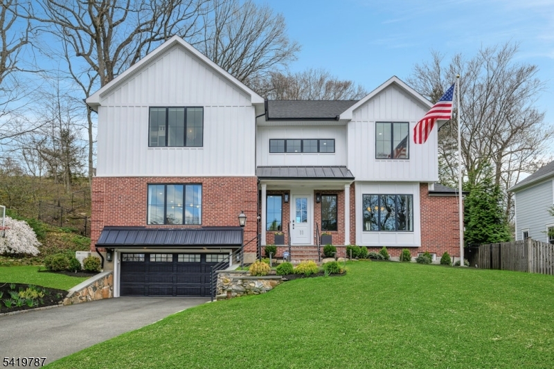 Exceptional 2020-built Northside home offering 5 bedrooms, 5 full and 1 half baths with 10 ft high ceilings. Renovated eat-in kitchen completed in 2025 with white cabinetry, large Thermador refrigerator, center island, two beverage/wine refrigerators and high-end finishes, with access to deck, open to bright living and dining areas. Formal dining room with custom buffet crafted from a single slab of wood. Expansive sun-filled living room with board and beam shelving and abundant natural light. First floor bedroom with full bath, currently used as a private office, offers flexibility for guests or workspace, plus powder room on this level. On the second floor, the primary suite features a custom California Closet and spa-like bath w/Gas FP w/glass media. 3 additional bedrooms include one ensuite and a Jack and Jill bath. Second floor laundry with cabinetry and sink. Finished basement with full bath offers flexible recreation, guest or media space. Professionally landscaped property with usable backyard featuring IPE decking, bluestone patio, lawn and drainage system. Retractable awning and Bullfrog hot tub create ideal outdoor living. Whole house generator, sprinkler system, exterior lighting and invisible dog fence. Custom garage with split heat, epoxy floors, Garage Tech storage system and separate storage room with shelving and additional refrigerator. Designer finishes and thoughtful upgrades. Prime Northside location convenient to downtown, schools and transportation.