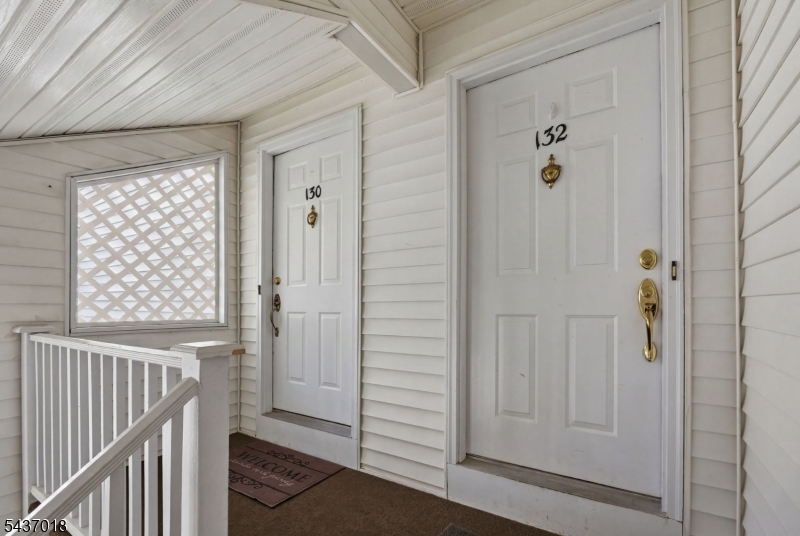 Welcome to this beautifully updated Essex II model in the sought-after Spring Ridge community of Basking Ridge. This light-filled second-floor condo offers 2 bedrooms, 2 full baths, soaring cathedral ceilings, skylights and an open-concept living and dining area. The stunning 2019 kitchen features 42" white cabinetry, quartz countertops, ceramic tile backsplash, under-cabinet lighting, stainless steel appliances and a large island with storage and seating. Rich wood laminate flooring and elegant crown, chair rail and baseboard moldings extend throughout the home. The spacious living room with wood-burning fireplace (as-is condition) flows seamlessly into the dining area, while oversized windows and skylights provide exceptional natural light. The primary suite offers a skylight, walk-in closet, and renovated bath (2022) with ceramic stall shower, updated vanity, toilet and tiled floor. The second full bath was updated in 2022. The second bedroom features a custom built-in bookcase and access to the balcony. Additional updates include all new windows (2023), washer/dryer (2021), HWH (2019), sliding glass door (2019) and HVAC (2011). A large basement storage area and one-car garage add convenience. Enjoy amenities including a pool, clubhouse, playground, tennis courts, bocce court, walking and biking paths surrounded by acres of preserved natural beauty. Conveniently located near shopping, dining, highways, public transportation and highly rated Bernards Twp schools.