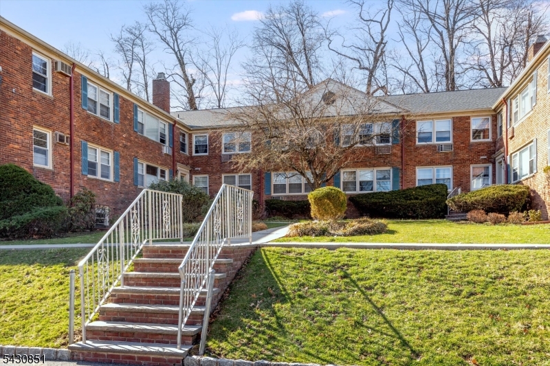 Beautifully Renovated Garden Apartment in beautiful West Orange, NJ. One of the most spacious garden apartments you'll find anywhere in the area, and it shows the moment you walk in. This stunning first-floor unit, in a classic brick low-rise has been thoughtfully renovated from top to bottom.  The layout is genuinely generous: a large living room, a formal dining room, and a beautifully updated kitchen with quality appliances. The primary suite features its own en-suite bath, and the second bedroom is large enough to actually live in with a full hall bath rounding out the floor plan. Hardwood floors throughout. Step outside or just look out your window and you're greeted by mature, flowering trees and lots of greenery. It feels like a retreat, even though you're right in the middle of everything. And "everything" really delivers here. The West Orange Jitney connects you directly to the Midtown Direct train line. School bus service runs on Northfield Ave. Shopping and dining are minutes away. And when you want to decompress, you've got Turtle Back Zoo, the South Mountain Recreation Complex, and the South Mountain Reservation practically in your backyard. Laundry in the building. Assigned parking included. And assigned basement storage.