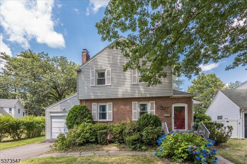 Amazing 4 bed colonial so close to center of Teaneck and 2 blocks to Cedar Lane.  Bus stop at corner of Kent and River and blocks to Terhune Park.  This home was lovingly cared for and the Living Room  has a gas fireplace and custom brick wall.  The Dining Room and Rec Room are adjacent and all have gleaming hardwood floors.  The Rec room has a 1/2 bath.  The kitchen is oversized with a separate eat in area granite counters and Recess lighting.  Plenty of light fills the Kitchen from the sliders to the back deck.  Upstairs there are 3 beds plus a Primary Bed Suite has magnificent Cathedral Ceilings and decorative beams that give it a lodge feel and very with a full bath. There is a full bath ensuite in the Primary Bedroom. The main Bath in the hall is available for the other Bedrooms. The Bedrooms have hardwood floors.  The basement is full and partially finished with a laundry room and 2 flex rooms to use to suit your needs.  Central air and public utilities and a whole house generator are the icing on the cake.  This great home will not last.
