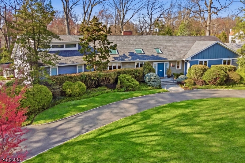 Set in the desirable Newstead neighborhood, this distinctive 1954 turn-key mid-century modern ranch is defined by light, scale, and a remarkable setting. With over 4,000 sq ft of flexible living space, 5BRs, and 4.1Bths, the home is flooded with natural sunlight and framed by oversized picture windows. A generous foyer with a new powder room opens to the main living area, where the WOW factor is the spacious living and dining room with huge picture windows, a wbfp, and a family room overlooking the expansive property. Nearly an acre of fully fenced, level grounds create a rare backdrop for everyday living and entertaining. The EIK features granite counters, a Sub-Zero refrigerator, Miele dishwasher, double wall ovens, and 2 skylights. The primary suite addition offers a private retreat w/heated bluestone patio, sitting room, stunning full bath, and a giant WIC. Two additional graciously sized BR's and a hall bath round out the bedroom wing. A 3-car attached garage opens to a mudroom with laundry, an additional BR, and full bath. The second level features a fifth BR, full bath, and a generous bonus space w/windows overlooking the backyard, ideal for an artist studio, office, or rec room. 2016 updates include custom built-ins, 3-zone HVAC, humidifier, UV systems, 2 water heaters, whole-house generator, French drains, and a dry utility basement; a new roof and Hardie Plank siding complete this impressive Newstead offering with presence, privacy, and exceptional livability.