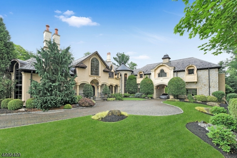 Welcome to this incredible 6 bedroom, 7 full and 1 half bathroom center hall colonial situated in the exclusive Pond section of Montville, NJ. This private estate brings resort-style living to you with over 2 acres of meticulously landscaped grounds, a luxurious pool area with stone patio, outdoor kitch en and a lower level built for entertaining. No expense was spared throughout this stunning home as evident by the extensive millwork, bridal staircase and the gourmet kitchen with center island and high-end appliances. Other features include a 2-story great room with Juliet balcony, library, billiard room, home theater and so much more. The full, finished basement is complete with a gym, screening room, walk-in wine cellar, bar, salon, recording studio and recreation area. Truly a must see!