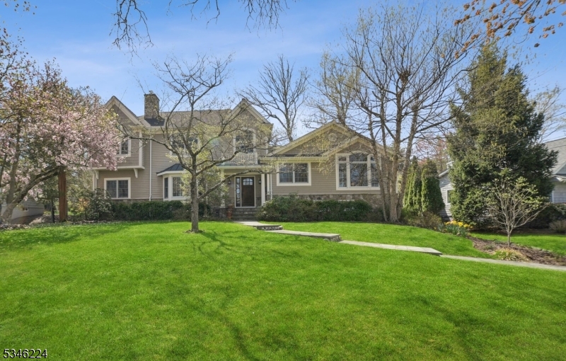 Welcome to 15 Wordsworth Road! Nestled in the coveted Poets Section of Short Hills, this exquisite  five-bedroom, four-bathroom custom home offers an unparalleled blend of traditional charm and modern amenities.Renovated and expanded in 2006, this home is designed for both luxury and comfort, highlighting spacious living areas and thoughtful details throughout. The main floor boasts a bright and welcoming two- story entrance foyer, with the living room and family room sharing a two- sided fireplace- providing the perfect ambiance for cozy evenings.You will love the brightly lit eat-in kitchen, featuring white wooden cabinets, Carrara quartz countertops, a farmhouse sink, hardwood flooring and stainless steel appliances.The luxurious primary bedroom,  located on the second floor is a true retreat with a gas fireplace, an en-suite bathroom with dual vanities, radiant heat floors, a soaking tub and a steam shower plus a large walk-in closet. The additional bedroom on the second floor is currently used as a home office. On the spacious third floor, you'll find three bedrooms with ample closet space, plus two full bathrooms, and a second family room - ideal for a playroom or media room. Enjoy the private backyard, complete with a serene patio perfect for outdoor dining and entertaining. Just minutes away from top-rated schools, parks, shopping, and public transportation!
