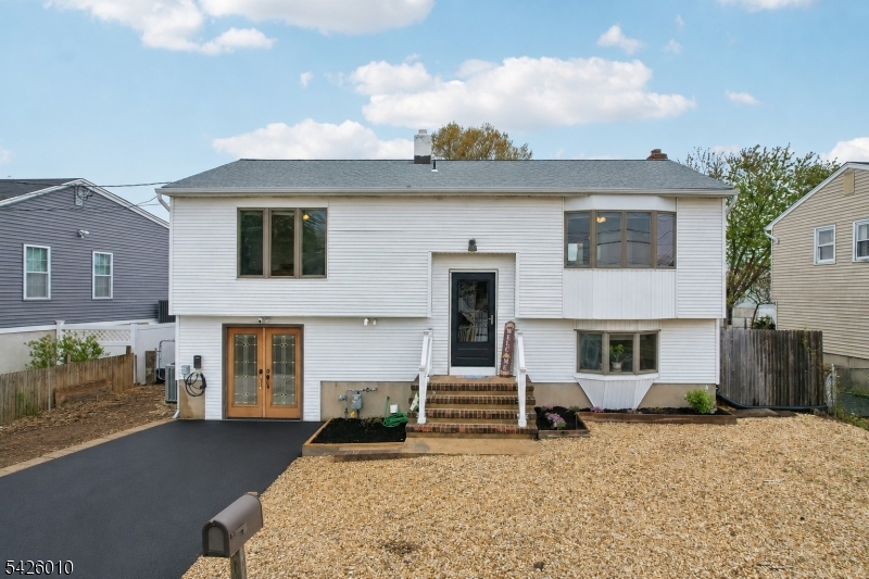 Welcome home to this beautifully maintained 3-bedroom, 2-bath bi-level in the heart of Toms River, where comfort, flexibility, and outdoor living come together. Thoughtfully designed with a versatile layout featuring two bedrooms upstairs and one downstairs, this home offers endless possibilities for guests, a home office, or additional privacy. The upper level features a spacious primary bedroom with a cedar closet, adding both charm and practical storage. Hardwood flooring awaits beneath the vinyl flooring, offering even more potential to personalize the space. Designed with entertaining in mind, the expansive deck, patio, and hot tub create the perfect setting for summer barbecues, relaxing evenings, or hosting gatherings year-round. Close to shopping, beaches, restaurants and more!