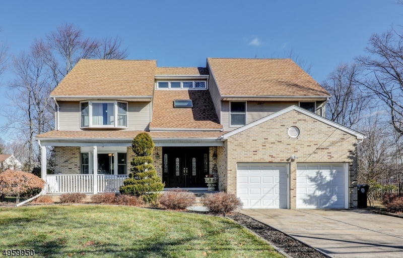 Move right in to this immaculate 5 BR and 4 Full Bath Colonial.  Huge Living/Family Room open to entertainer's Kitchen w/ granite countertops. Formal DR w/ french doors open into Sun Room/Office. 1 BR on main floor, 4 spacious BRs on second floor including Master BR en suite and walk in closets.  Deck has two separate entrances and large level backyard. Full finished basement w/ Bathroom, tons of space and storage!  New Roof (2019), high ceilings, hardwood floors, recessed lighting, underground sprinkler system and 2 Car garage complete this turnkey home!  Close to to all shopping and minutes from major highways and NYC!