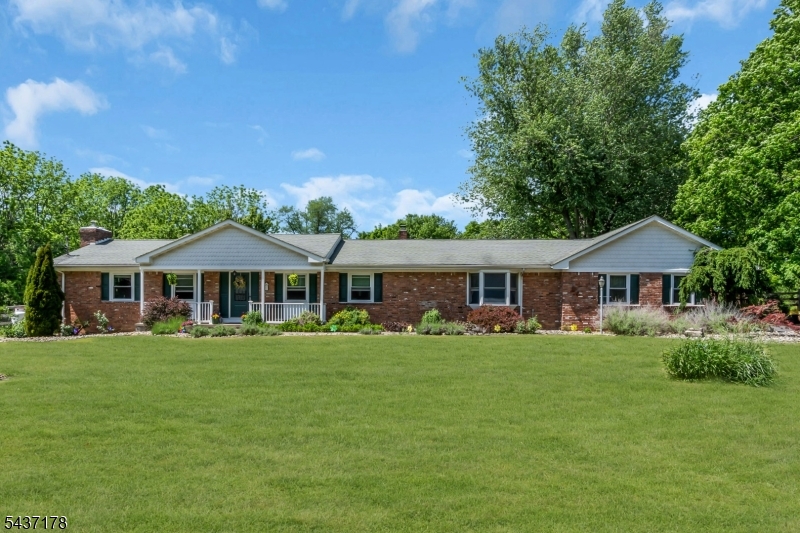 This spacious 4-bedroom, 4-bath ranch with TWO primary suites offers exceptional single-level living on a large, private property with a mini farm set-up already in place.This home has been lovingly updated by the current owners and offers the perfect blend of privacy, charm, and convenience. This expansive ranch features an open floor plan ideal for everyday living and entertaining. Enjoy the open-concept kitchen and living area, complete with updated finishes, generous counter space, and a layout ideal for entertaining.The living room features vaulted ceilings, a custom wood burning fire place and skylights to welcome in loads of natural light. The den is large enough to be used as a second living room, large office or play room.There are two primary bedrooms each featuring updated en suite bathrooms. The finished basement is very large and offers the potential for many uses. Outdoors, the property truly stands out. A serene koi pond creates a peaceful focal point, while the barn offers flexible use for livestock, storage, or hobby farming. The acreage provides ample room for recreation, gardening, or future expansion.The yard is fully fenced. This property combines modern updates with country appeal perfect for buyers seeking space, privacy, and a turnkey home.