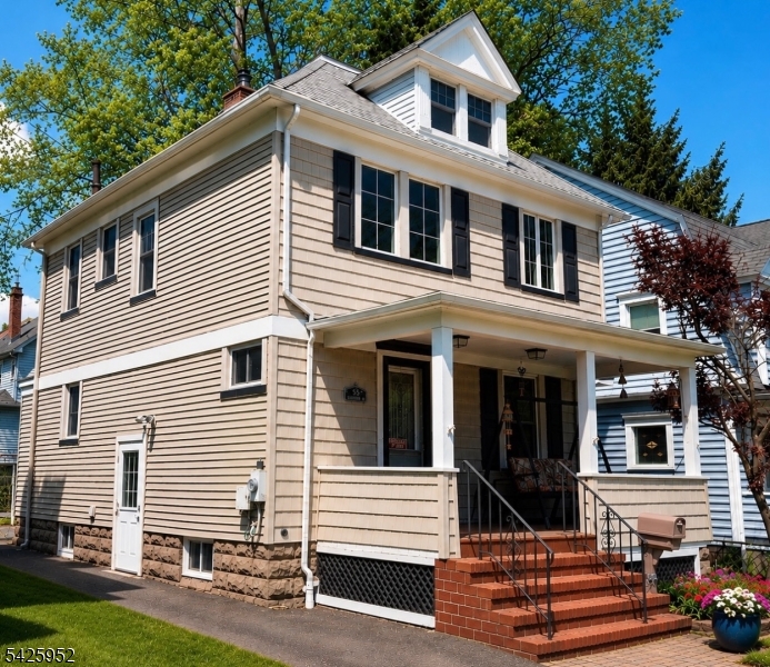 Thoughtfully preserved and full of timeless character, this spacious Colonial blends original craftsmanship with everyday functionality. Rich woodwork, detailed moldings, classic columns, original doors, and beautifully preserved trim create warmth and architectural character throughout the home. Comfortable living and dining spaces offer a welcoming flow for both entertaining and daily living, while the updated kitchen features stainless steel appliances, abundant cabinetry, and generous workspace.The second and third levels provide flexible living options with spacious bedrooms, home office potential, guest space, or playroom versatility. Natural light fills the home, highlighting the depth and quality of the original details that have been carefully maintained over time.Outside, enjoy a large backyard with composite deck, patio space, storage shed, and room for entertaining, relaxing, gardening, or outdoor activities. Conveniently located near parks, schools, shopping, transportation, and downtown amenities, this home offers a rare opportunity to own a thoughtfully preserved residence with timeless character, flexible living space, and everyday convenience. Please note: Photos have been digitally enhanced
