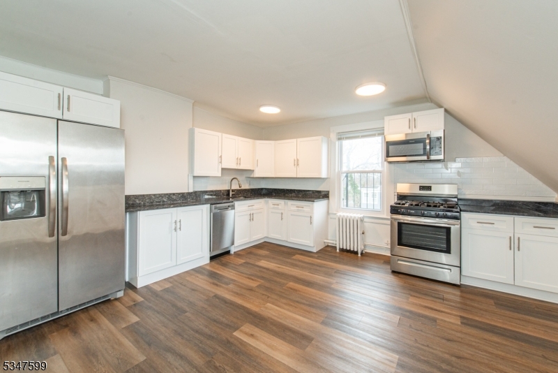 Location, Location, Location! This affordable top floor 3 bedroom, 1 full bath unit is one block from the heart of Downtown Summit & Weekly Farmer's Market. Unit is complete with a large updated kitchen with granite countertops, SS appliances, chair rail moldings, laminate flooring throughout and skylights which bring in natural lighting. High efficiency whisper quiet window AC units are provided in every room - enjoy the benefits of public utilities and natural gas! This home is a commuter's dream, close to major highways and Newark airport, as well as Restaurants, Shopping, Entertainment and walking distance to Train Station where you can catch the Midtown Direct Line to NYC.