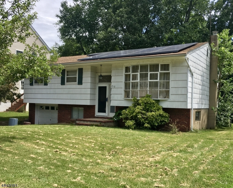 Bright & Sunny Bi-Level located on level lot in desirable Lake Parsippany. Large Eat-In-Kitchen w/ separate dining area. Open, BRIGHT living space w/ high ceilings & oversized picture window. 1st Floor offers 3 generous bedrooms & full bath. Ground floor provides a great family room w/ wet bar, 4th bedroom, full bath, laundry & 1 car garage access. Tons of Versatile Living Space! Opportunity Knocks! Central Air, natural gas, public water, sewer & much more! Newer furnace! Back door leads to lovely, flat backyard and barbeque area for play & relaxation. Great schools, reasonable taxes, vibrant community & just minutes to nearby mass trans & hwys.