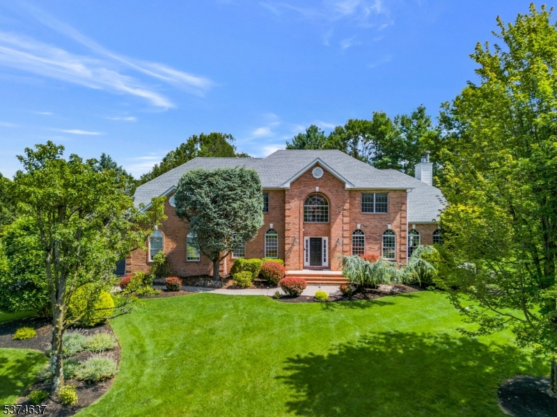 Nestled on a quiet cul-de-sac in highly desirable Greenwood Meadows, this impeccably maintained & beautifully updated 4BR, 3.1 BA brick-front Center Hall Colonial offers luxurious living inside and out. Step into the grand two-story foyer w/ an elegant open-concept layout featuring LR and DR, office w/ vaulted ceilings, spacious FR w/ FPL & gourmet kitchen updated in 2018 and showcases 18"x18" natural Travertine tile floors, Quartz countertops and center island breakfast bar, Viking 6-burner gas cooktop, KitchenAid double electric convection oven, KitchenAid Architect Series 42  built-in refrigerator, Marvel 24  wine fridge. Upstairs, all HW floors, begins with the luxurious primary suite w/ sitting room (ideal as a second office, nursery, or gym), a huge walk-in closet & brand-new spa-like bath (2023). 3 add'l spacious BRs share a beautifully updated main bath (2022). Finished basement expands living space w/ large rec room, guest room/office, full bath & abundant storage. Private backyard oasis (2015) is a true showstopper! Custom freeform heated gunite saltwater pool w/ waterfall and integrated spa. Expansive 3-level patio, prof landscaping, fully fenced-in yard w/ a large covered pavilion boasting wood-plank ceiling & wood-burning FPL. Plus outdoor kitchen complete with 48" grill, granite counters & bev refrigerators. New roof (2021), Generac whole-house generator, oversized 3 car garage! Convenient location minutes to The Pingry School and Rt. 78 for easy commuting.