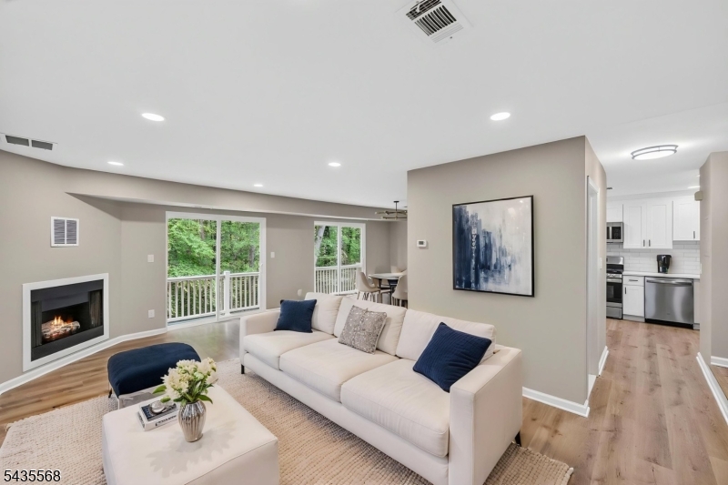 Welcome to this newly renovated 2-bedroom, 1.5-bath end-unit townhome nestled in the sought-after community of The Meadows. Tucked away in a prime location backing to peaceful wooded views, this home offers the perfect combination of privacy, modern updates, and everyday convenience just moments from shopping, dining, highways, and transportation. The sun-filled main level features an open and inviting layout highlighted by a cozy gas fireplace and sliding doors leading to a private deck, ideal for relaxing or entertaining while enjoying the tranquil setting. The updated kitchen is designed to impress with quartz countertops, stainless steel appliances, and new cabinetry. A stylishly updated powder room completes the first floor. Upstairs offers two spacious bedrooms with generous closet space, including a comfortable primary suite, along with a beautifully updated full bathroom. Additional features include central air, natural gas heat, public utilities, and an attached 1-car garage providing both convenience and extra storage. Residents of The Meadows enjoy access to community amenities including a pool and playground, all while benefiting from low-maintenance living with low taxes and HOA fees. Thoughtfully updated and completely move-in ready, this is an exceptional opportunity to own in one of the area's most desirable townhouse communities.