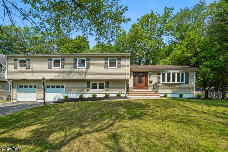 Best Summer in this TRUE BACKYARD RESORT with an inground HEATED gunnite DIAMOND BRITE POOL.  Situated on a LEVEL .43-ACRE LOT this  2,800+ Sq Ft  Split-Level offers comfortable living space on 3 Levels.  Spacious Eat-In Kitchen features ample cabinetry, generous counter space, Walk-IN PANTRY and a sunny seperate eating area overlooking the  PLAYABLE yard and POOL.   A large Bay Window fills the spacious Living Room with natural light as it transitions seamlessly into the Dining Room.   2nd Level hosts all 4 bedrooms and 2 Full UPDATED Bathrooms. The Primary En-Suite ADDITION  boasts a WALK-IN closet and a HGTV UPDATED SPA-LIKE Bath with Soaking Tub, Oversized Stall Shower and Double Vanity.  COZY Family Room with Wood Burning Fireplace and 2 Walk-Outs to the Expansive Patio, Lounge area and Pool deck - PERFECT for ENTERTAINING! Ideally located in close proximity to top-rated Livingston High school, State-of-the-Art Public Library, Kings supermarket, and NYC transportation. Enjoy Life in Livingston!
