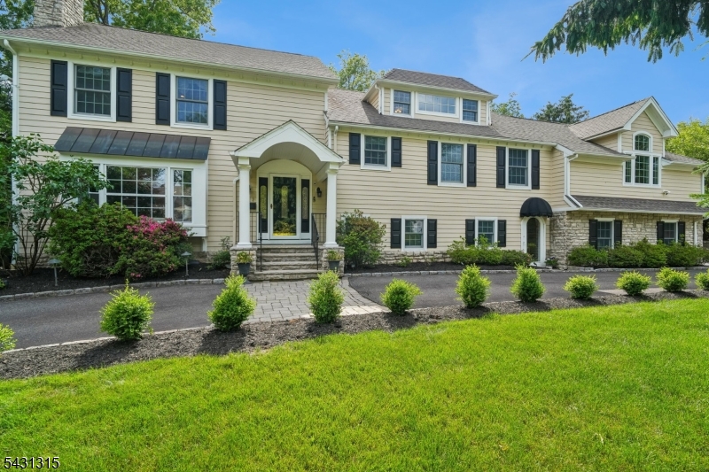 Mint Condition 5200 sq ft Custom Home built in 2000 & renovated in 2017 with great amenities - a whole house generator front door is east facing so perfect Vastu on .57 acre lot  in an ideal location walking distance to Gero Park, the town's recreation center w/ baseball fields, tennis & pickleball courts, basketball courts, town pool & par 3 golf course! Has perfect open floor plan, soaring ceilings, gourmet eat-in kitchen totally open to the family room with high ceilings & floor to ceiling stone gas fireplace, a dining room open to the kitchen - perfect for entertaining, & a relaxing living room with fireplace & bay window. The family room has French doors out to the spacious deck overlooking the beautiful totally level &  fenced backyard. The spectacular primary suite features high vaulted ceilings, 2 walk-in closets & spa-like primary bath w/ Jacuzzi.& shower ,  4 more bedrooms w/ backstairs to gorgeous Guest Suite wi/ vaulted ceiling, en suite bath & incredible privacy w/ a separate entrance. Beautifully finished lower level features a large rec room w/2 windows & FP, a powder room & a  media room w/projector, 8' screen & speakers. Great features including circular driveway, security system, spacious deck & attached 2-car garage with EV Charger. Ideal location walking distance to Pingry School for K-5 (0.2 miles), Gero Park (0.3 miles), Hartshorn Elementary  K-4 (1.0 mile), & w/ bus  provided for highly rated Washington  (5th grade), Millburn Middle  & Millburn High .