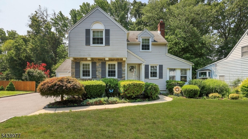 Cherished by the same family for nearly 60 years, this charming 3-bedroom, 1-bath Colonial offers a rare opportunity to own a home backing directly to picturesque Mohawk Park. Set on an oversized .20-acre lot, the backyard feels like a natural extension of the park, with a private gate providing direct access to scenic walking trails, a peaceful pond, and open green space where deer and other wildlife are frequent visitors. The spacious rear deck overlooks the backyard and connects to a patio below, creating wonderful spaces for outdoor dining and entertaining. A dedicated natural gas line is already in place for a grill. Inside, vintage details and hardwood floors believed to exist beneath much of the carpeting offer the opportunity to restore the home's original character. The spacious living room features a wood-burning fireplace (as-is), complemented by a formal dining room,  sunroom/den with access to the deck, and an eat-in kitchen. Upstairs are three bedrooms and a full bath, while the full basement includes a partially finished recreation area, laundry, and abundant storage. Approximately two-year-old forced-air gas heat and central air conditioning add peace of mind.Offering one of Cranford's most picturesque park-side settings, this cherished home is ready for its next chapter. This is an estate, with the home, roof, and fireplace conveying in as-is condition. (no known isssues). Flood insurance is not currently required.