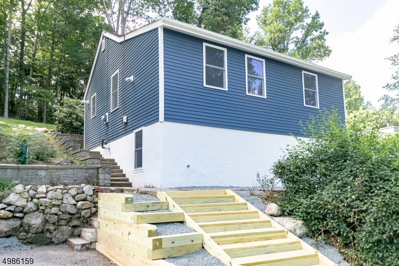 WOW! COMPLETELY RENOVATED RANCH FEATURING BRAND NEW KITCHEN W/GRANITE, S/S APPLS, BEAUTIFUL NEW FIXTURES, HDWD FLRS! ASLO NEW ROOF, WINDOWS, C/A, DRIVEWAY, RETAINING WALL, SEPTIC AND MUCH MORE! LARGE LIVING ROOM,  GREAT STORAGE SPACE, WALK OUT BASEMENT, NICE YARD. DONT MISS OUT ON THIS TURN KEY PROPERTY LOCATED IN THE STANHOPE SIDE OF HOPATCONG!