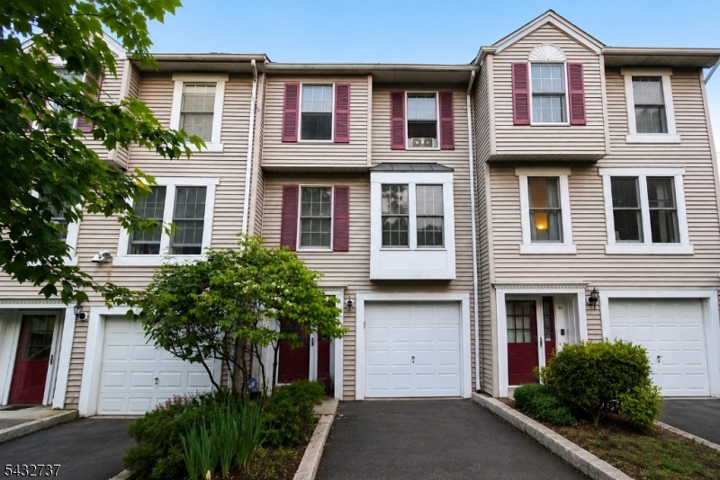 Welcome to this spacious 3-bedroom, 2.5-bath townhouse located on Tiffany Blvd in Newark with a ton of potential. Featuring hardwood floors throughout and a functional multi-level layout, this home offers great potential for a buyer looking to add their own updates and personal touch.Enter through the foyer with access to the attached garage and a first-floor bedroom, ideal for guests, a home office, or additional living space. The main level offers a bright living room, dining area, kitchen, and half bath, along with access to a private deck perfect for relaxing or entertaining. Upstairs, you'll find generously sized bedrooms, including a primary suite with its own full bath.Conveniently located near Branch Brook Park and the future Newark-to-Hoboken Greenway trail, this home offers easy access to recreation, transportation, shopping, and dining while providing excellent value and space in an evolving Newark neighborhood.