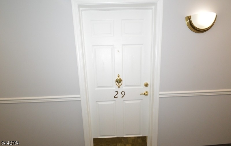 Spacious Two bedroom unit in front of building features open floor plan, new paint & carpet, kitchen w/Oak Cabs, DW, Refrigerator & large pantry closet, private balcony... Laundry on each level, Community Room offers great place to gather and enjoy recreation activities including pool table & exercise room? Back paver patio overlooks pond & Gazebo, offering additional seating & gas grill.. Easy walk to town & train!