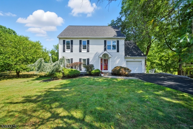 Welcome to 232 Riverside Drive West in Denville, a spacious and inviting Colonial that blends comfort, functionality, and modern updates. Built in 1995 and thoughtfully remodeled in 2017, this 4-bedroom, 2.5-bath home sits on nearly an acre of property, offering both privacy and room to grow. The main level features sun-filled living and dining areas, along with an eat-in kitchen complete with a center island, pantry, and open flow into the dining space?perfect for gatherings large or small. Upstairs, the primary suite includes its own full bath, while three additional bedrooms provide flexibility for fam, guests, or office use. With 2.5 bathrooms, convenience is ensured throughout the home. Step outside to enjoy the level 0.92-acre lot, ideal for entertaining, gardening, or relaxing. The deck extends your living space outdoors, while the lush yard offers endless opportunities. Completely fenced in and located on the scenic Rockaway River. Practical features include an attached garage, ample driveway parking, natural gas heating, central air, and even a generator hookup for peace of mind. Stylish details like wood and tile floors and new roof complete the package. Located in a quiet, desirable neighborhood at the end of a Cul De Sac with highly rated schools, this property provides the perfect balance of tranquility and accessibility. With modern amenities, generous living spaces, and a large lot, this property is ready to welcome you home.