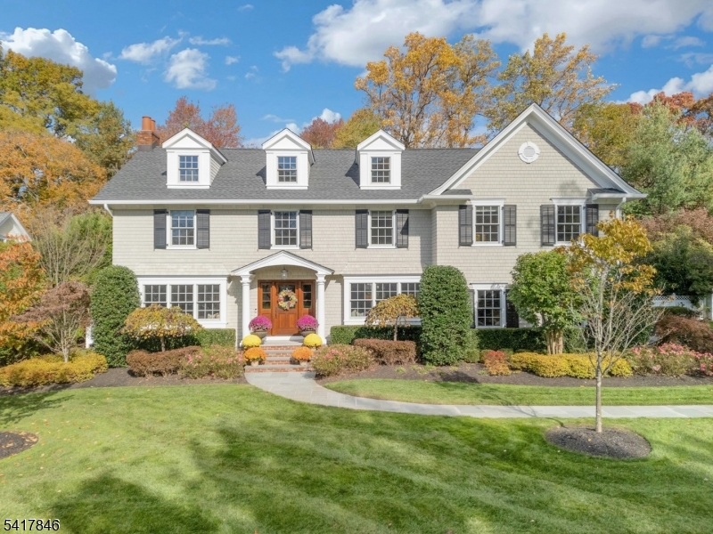 LIGHT & BRIGHT BEAUTIFULLY RENOVATED COLONIAL IN ONE OF CHATHAM'S MOST DESIRABLE NEIGHBORHOODS! Nestled in the heart of Wickham Woods on a quiet street amid gorgeous resort-like property lies a truly special home masterfully updated in every way. Move-in ready is an understatement at this 4-5 Bedroom/3.1 Bath home completely renovated in 2018. Picture-perfect exterior features Backyard oasis with stone fireplace, outdoor TV, outdoor kitchen w/ grill & fridge set on a beautiful bluestone patio with stone walls and custom lighting. Inside wows with stunning millwork & built-in cabinetry, hardwood floors throughout, oversized windows drenched in light, 3 fireplaces, newer bathrooms, doors, hardware & light fixtures. Living & Dining Rooms highlighted by large bay windows with window seats overlooking front yard. Eat-in Kitchen/Family Room stretches along back, full of light & warmth w/ great layout. Custom maple cabinetry, Wolf gas range, Sub-Zero fridge, breakfast nook w/ banquette seating, stone fireplace & walls of windows offer views of amazing backyard. All-season Sun Room has brick-tiled floor, glass doors on 3 walls & easy access to expansive patio for ultimate indoor/outdoor living. 2nd Level boasts 4 great-sized Bedrooms, Office & Laundry Room with custom cabinetry throughout. Primary Suite has soaring tray ceilings, incredible walk-in closet & high-end ensuite Bathroom. Finished Lower Level & unfinished Attic w/ great potential. Too many updates to mention, a must see!