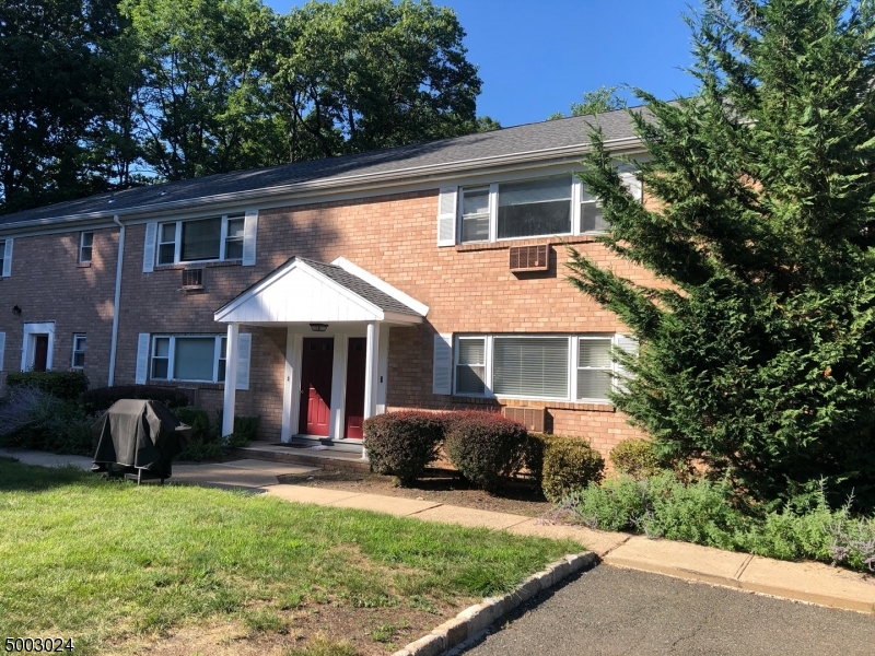 Move right in to this 2nd floor condo with beautiful hardwood floors throughout. Fantastic location directly next to Tennis Courts, yet very private. The condo is in great condition with open archways for easy entertaining and lots of windows for natural light. Kitchen has newer stove and refrigerator and features a breakfast bar.  Bedroom has two nice sized closets.  2 newer air conditioning units included.  Storage will not be a problem as this unit has 4 closets in addition to the lockable space available in the coin-operated laundry room. Convenient parking directly infront of door.  Club house, pool, tennis courts, gym & sauna included in the low HOA fees. Strictly as is sale.