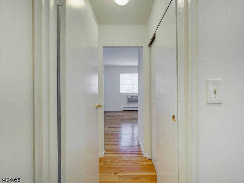 Beautifully maintained and move-in ready 1BR/1BA unit in the desirable Mt. Club community. This home offers a wooded view from the front windows and a comfortable, private setting. The updated kitchen features granite countertops, warm wood-tone cabinetry with glass accents, molding, tile backsplash, and tile flooring. Hardwood floors run throughout the living room and bedroom. Secure storage is located in the shared basement/laundry room with exterior access. Amenities include tennis courts, pool, gym, clubhouse, and sauna. Conveniently located near NJ transit, shopping, and restaurants. Assigned parking space #294 is conveniently located directly behind the building.