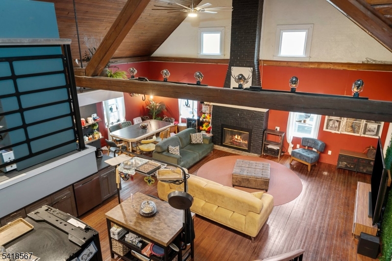 Own a true piece of history-this extraordinary residence was once a chapel, beautifully preserving its original architectural charm while offering modern living. From stunning arched doorways and rich hardwood floors to soaring cathedral ceilings and breathtaking stained-glass windows, every detail tells a story. Vintage cast iron and brass lighting add character throughout, while the original slate roof remains a testament to the building's timeless craftsmanship. A connecting mudroom links two distinct sections of the property, blending historic beauty with modern updates. The main living area features 3 bedrooms, plus an upstairs office or optional bedroom with a half bath: vaulted ceilings, a large open kitchen, and a beautiful gas fireplace. The finished basement expands your living space with a full bathroom, laundry room, gas fireplace, two bonus rooms, and a large open living area with its own separate entrance. All utilities are less than 5 years old, home is equipped with central air. Adding even more value, the adjacent commercial lot is also listed for sale, MLS# 4028994. It offers endless possibilities for development, whether you envision a boutique or a coffee shop. ice cream parlor, or another creative venture. Zoned commercial town center, this one-of-a-kind property offers incredible flexibility for residential, business, or mixed-use opportunities. Bring your imagination and unlock the full potential of this truly remarkable property.
