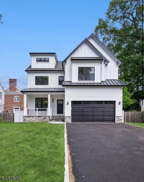 Welcome to this exceptional new construction home in highly sought-after Livingston, just moments from Harrison Elementary School. This stunning residence offers 5 bedrooms, 5 full baths, and 1 half bath.The main level features 9-foot ceilings, wide-plank engineered hardwood floors. A formal living room & dining room provide refined entertaining spaces, while the chef's kitchen serves as the heart of the home with quartz countertops, custom cabinetry, premium Thermador appliances, and an oversized center island. The kitchen opens seamlessly to the dramatic family room, highlighted by a floor-to-ceiling tiled fireplace and sliding glass doors leading to a spacious deck.  Upstairs, the luxurious primary suite features dual walk-in closets and a spa-inspired bath. Three additional bedrooms include one en-suite bedroom and two bedrooms connected by a Jack-and-Jill bath. A convenient second-floor laundry room completes the level.The finished lower level expands the living space with a large recreation room, an additional bedroom and full bath, plus ample room for a gym, office, media room, or play area. The finished third floor offers a spacious bonus room with a full bath, ideal as a guest suite, home office, recreation room, or media lounge. Combining sophisticated finishes, exceptional craftsmanship, and a premier location within Livingston's top-rated school district, this remarkable home offers luxury, comfort, and convenience in one.