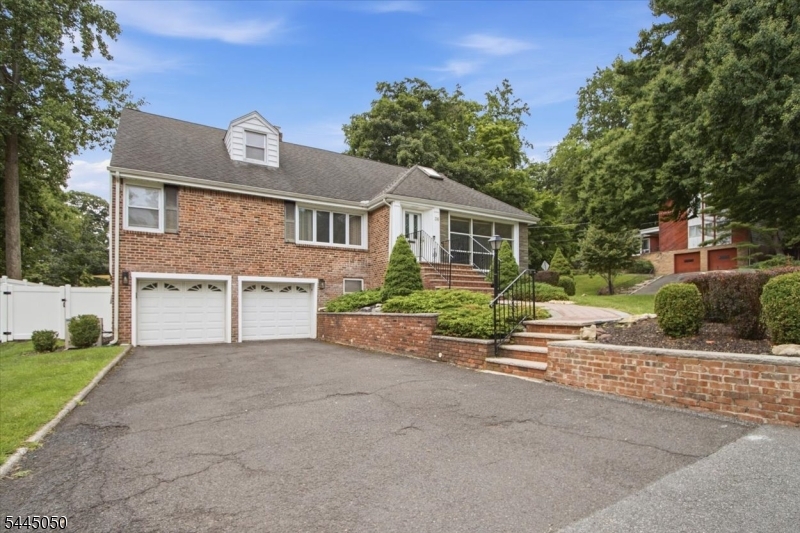 Spacious and well-maintained 5-bedroom, 3-bath Cape offering ample space for comfortable living. The first floor features 3 bedrooms, a full bath, a bright living room, a formal dining room, a cozy den, and a modern kitchen with a breakfast nook, 2 sinks, and 2 dishwashers, perfect for everyday living and entertaining. The second floor offers a private primary bedroom with a walk-in closet and en-suite bath, plus an additional bedroom. The finished basement provides exceptional additional living space, including a large recreation room, bonus room, full bath, laundry room, and a separate utility/storage room. Cedar closets and abundant storage throughout add to the home's functionality. Additional features include 2-zone central air conditioning, a deck and patio ideal for outdoor entertaining, and ample storage throughout. Conveniently located near schools, houses of worship, major highways, and public transportation, this home offers the perfect combination of space, comfort, and accessibility. Seller will provide a 1-year home warranty with an acceptable offer. Don't miss this wonderful opportunity!