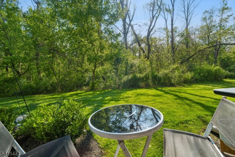 Welcome to this beautifully updated 2-bedroom, 2-bath condominium in the highly desirable Society Hill community of Basking Ridge. Filled with natural light and surrounded by peaceful wooded views, this move-in-ready home offers the perfect blend of comfort, style, and convenience.The updated kitchen features white cabinetry, quartz countertops, subway tile backsplash, stainless steel appliances, and a breakfast bar that opens to the dining area. The spacious living room is bathed in sunlight and offers seamless access to a private patio overlooking a tranquil natural setting.The primary suite features a custom California Closet & a beautifully renovated en-suite bath. A generously sized second bedroom & full hall bath provide flexibility for guests, a home office, or everyday living. Recent improvements include luxury vinyl plank flooring, replacement windows, a new sliding glass patio door, updated kitchen, renovated primary bathroom, custom California Closet system, newer HVAC, and a newer hot water heater.Additional conveniences include in-unit laundry, abundant storage, and assigned parking.Residents enjoy Society Hill's outstanding amenities, including a clubhouse, swimming pool, tennis courts, playground, walking and biking paths, and beautifully maintained grounds. Ideally located near Routes 78 and 287, shopping, dining, NJ Transit, and Pleasant Valley Park, this home offers a low-maintenance lifestyle in one of Basking Ridge's most sought-after communities