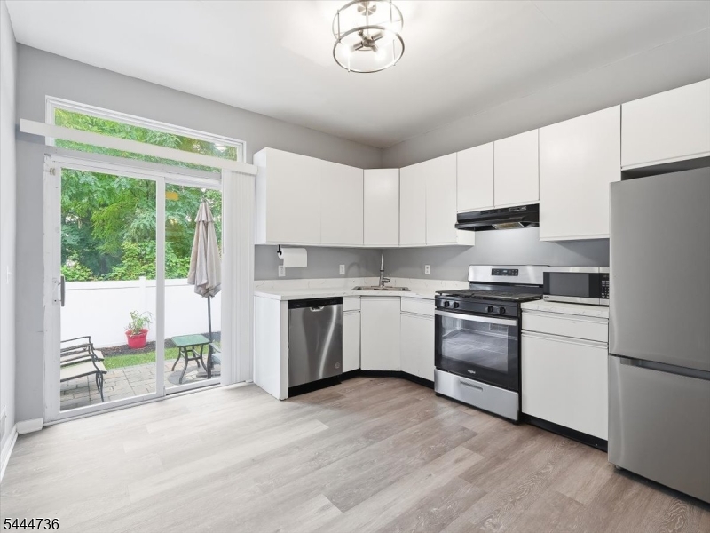 Welcome to 4 Derby Street! This well-maintained, interior-unit townhome is tucked away on a dead-end street. The first floor offers a comfortable living room with a cozy fireplace, an eat-in kitchen featuring newer appliances, and direct access to a private backyard patio perfect for grilling, relaxing, or entertaining. You'll also find a convenient first-floor laundry closet, a half bathroom, and additional storage. Upstairs are two generously sized bedrooms, including a spacious primary suite with high ceilings and two closets. A full bathroom and pull-down attic access provide even more functionality and storage.Ideally located just minutes from South Orange, public transportation, and the VA Hospital, this home offers the perfect blend of comfort, convenience, and low-maintenance living. Schedule your tour today!