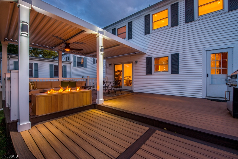 Phenomenal gut renovation from top notch builder, keeping true to the character of DWTN Denville w/gorgeous designer fixtures & luxe finishes. Well-appointed spacious kitchen & FR w/high ceilings. Maple cabinets, SS appliances & granite countertops. Formal DR leads you to the ultimate outdoor living! 2-tiered trex deck, covered pergola & gas fireplace. Vinyl-fenced in yard w/shed & perennials. 1st floor bdrm, bath & formal LR complete this level. Upstairs is right out of HGTV. Sun-filled sitting area w/built in bookshelf doors. Grand master w/ensuite & walk through closet + 2 addtl bdrms. Details of nature visually tie into the marbled pottery sinks, driftwood vanities & multiple shower fixtures of the gorgeous 2nd floor baths. W/in walking distance of Denville's bustling DWTN, & NYC Direct mass transit!!