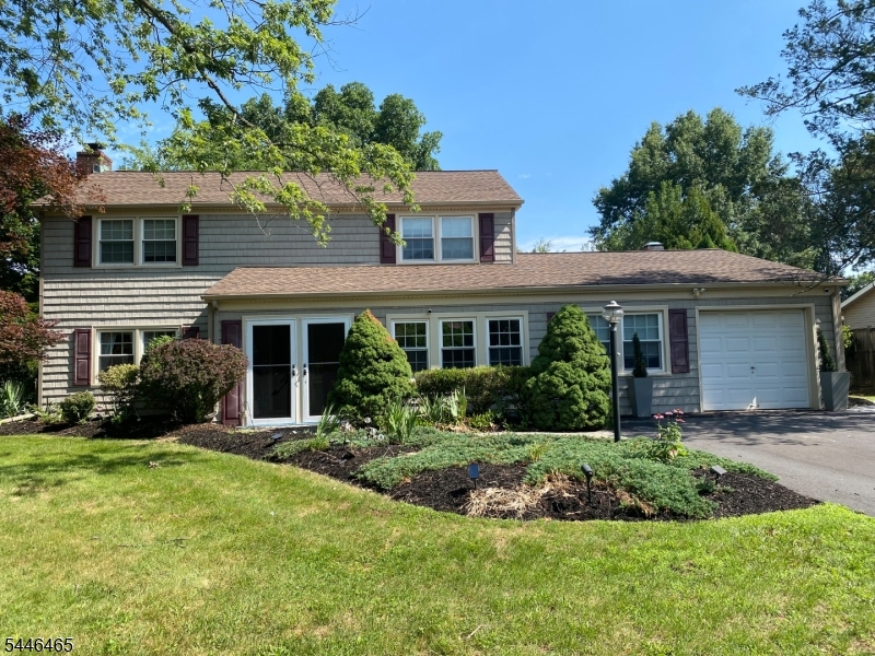 This spacious 3-bed Levitt colonial situated on a large private lot offers expanded living space with an added great room and flexible bonus room that can be used as a 4th bedroom, office, or den. Features include a large eat-in kitchen with abundant cabinetry and wet bar; updated bathrooms (2021); enclosed south-facing porch; newer roof (2020); vinyl siding and windows; & 2-zone HVAC. Enjoy outdoor living throughout the year, by relaxing on the south facing enclosed front porch or entertaining on the stamped concrete patio with natural gas BBQ grill while enjoying serene views of Inman Park. Combining classic colonial charm with modern improvements, expanded living space, & a rare private backyard setting, this home offers the ideal blend of comfort, convenience, & versatility.
