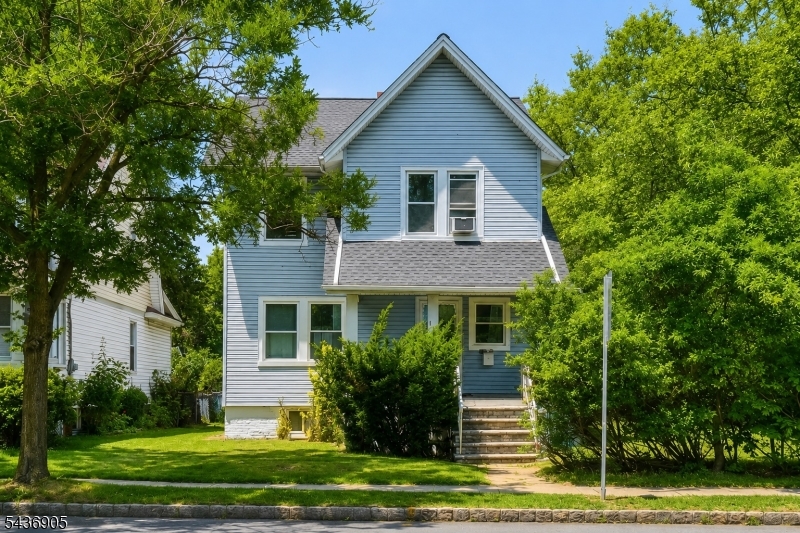 Overlooking the 62-acre Watsessing Park, this charming Colonial offers space, character, and a prime location in one of Bloomfield's most convenient neighborhoods. Just moments from NYC-direct trains, local shops, restaurants, and everyday amenities, you'll enjoy the best of both nature and city access. This spacious 4-bedroom, 2.5-bath home features beautiful period details throughout. The main level includes a welcoming entry foyer with coat closet, a living room, dining room, kitchen, and convenient powder room. Upstairs, the generous primary bedroom offers a bonus sitting room or home office, along with two additional bedrooms and a full bath. The third floor features a fourth bedroom with ample space to expand! The finished lower level provides additional living space, a full bath, laundry area, and plenty of storage. A rare two-car garage, currently used as a gym, plus driveway parking for two or additional vehicles adds even more convenience.