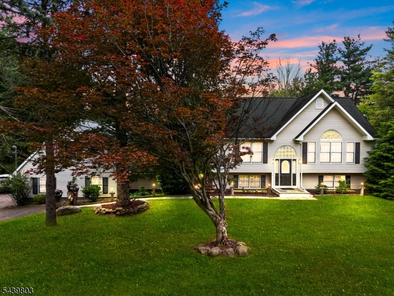 Prepare to be impressed by this magnificent, 4,600+ sq. ft. custom-built home offering an unparalleled blend of grand scale, natural beauty, and unmatched value. Situated on just under a pristine, park-like acre, this estate provides exceptional privacy and a tranquil escape surrounded by nature, all while remaining incredibly convenient?located just down the street from the local top-rated high school. Inside, the home?s incredible volume takes center stage with high ceilings throughout and an abundance of oversized windows that flood the massive living spaces with glorious natural light. The sprawling layout includes 5 spacious bedrooms, 3 full bathrooms, and a stunning sunroom perfect for enjoying peaceful, picturesque views all year round. The massive primary suite is a true sanctuary, complete with a dedicated bonus room ideal for a private office, or gym. Practical needs are effortlessly met with an oversized three-car garage offering ample storage. Best of all, you can move right in with total peace of mind thanks to major recent upgrades, including a brand-new furnace and a brand-new well pump. Offering a rare combination of footprint, acreage, and pristine setting, this estate represents a value like no other on the market today. Schedule your private tour today!