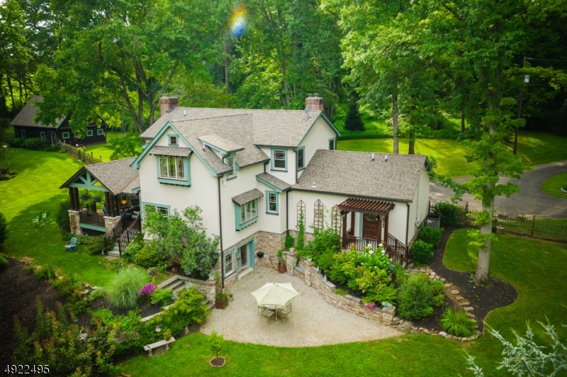 This 3 bed, 3 bath custom Craftsman-style Colonial was completely renovated & expanded from 2008-2010. This work of art is open & spacious with antique lighting & custom oak trim throughout. The master suite includes two walk-in closets, a fireplace and a bathroom with a shower, soaking tub, & cathedral ceiling. The gourmet eat-in kitchen boasts soapstone counters, double pantries, Crown Point cabinetry, & an adjacent covered mahogany deck leading to the scenic backyard. The large basement includes a finished rec room/office with walkout access to the patio. Nestled on 6 acres with 343 feet of private riverfront on the South Branch of the Raritan River just below its stocking point. Also features copper gutters/rain chains, 3 custom oak fireplaces, a 1600 sq.ft. Kistler Barn, & an attached 2-car garage.